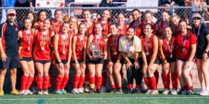 Picture of Divine Savior Holy Angel Field Hockey Team in red uniforms after winning the state championship