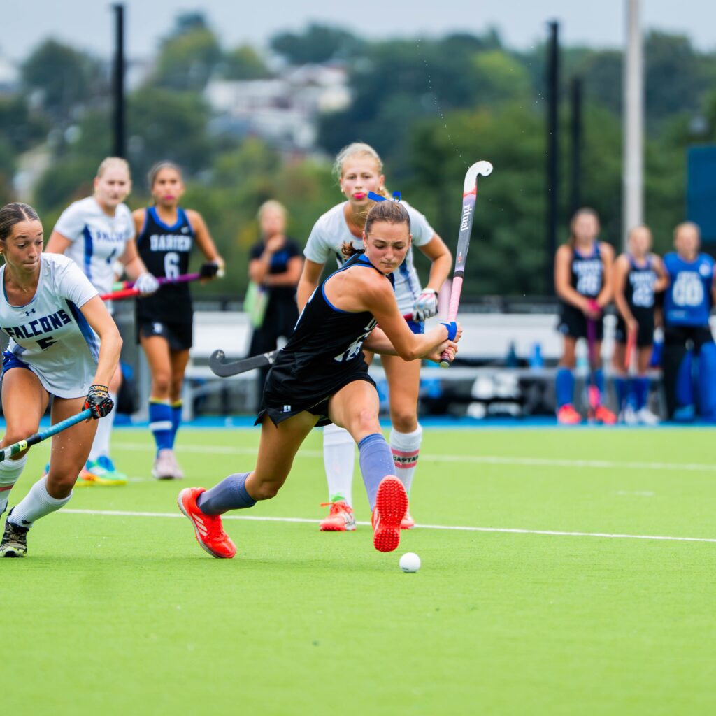 Field hockey athlete playing on the field